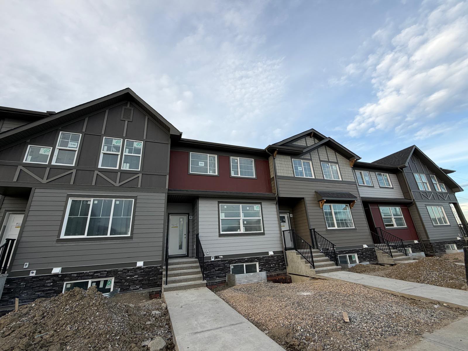 Recently completed 5-plex featuring Hardie shakes, Hardie panels with trim, Hardie siding, board and batten, and soffit fascia.